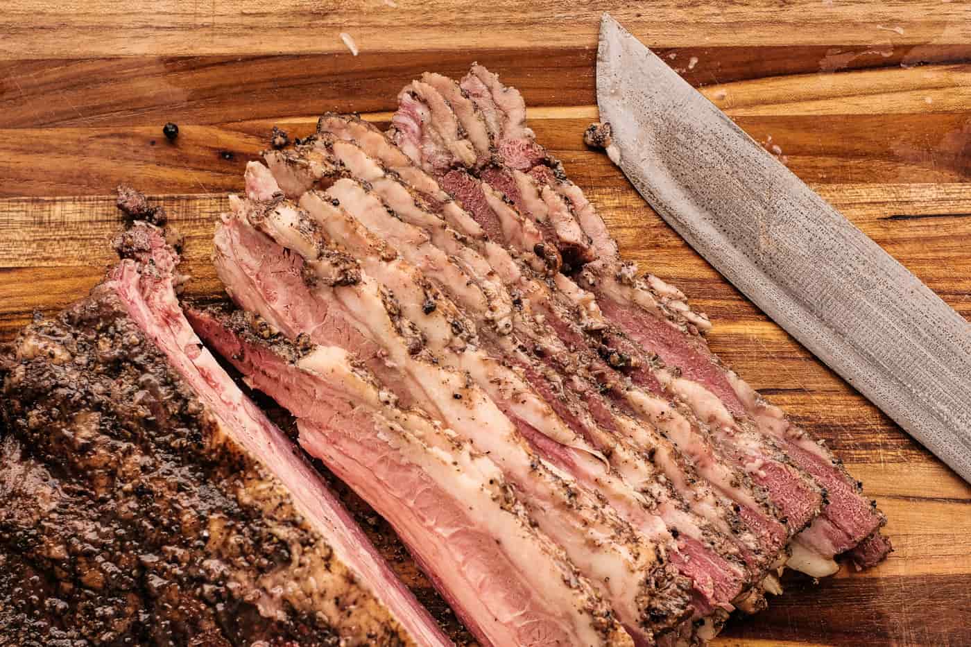 A raw whole packer brisket on butcher paper before trimming